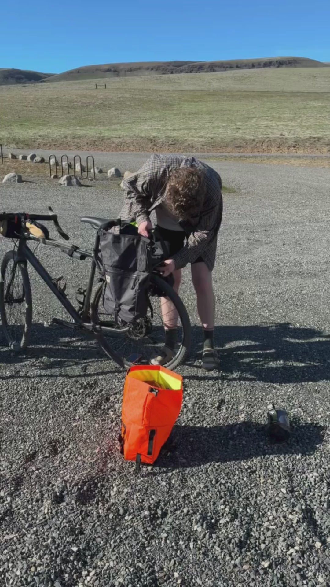 Bikepacking adventure showing 2 cyclists loading bags for a gravel ride.