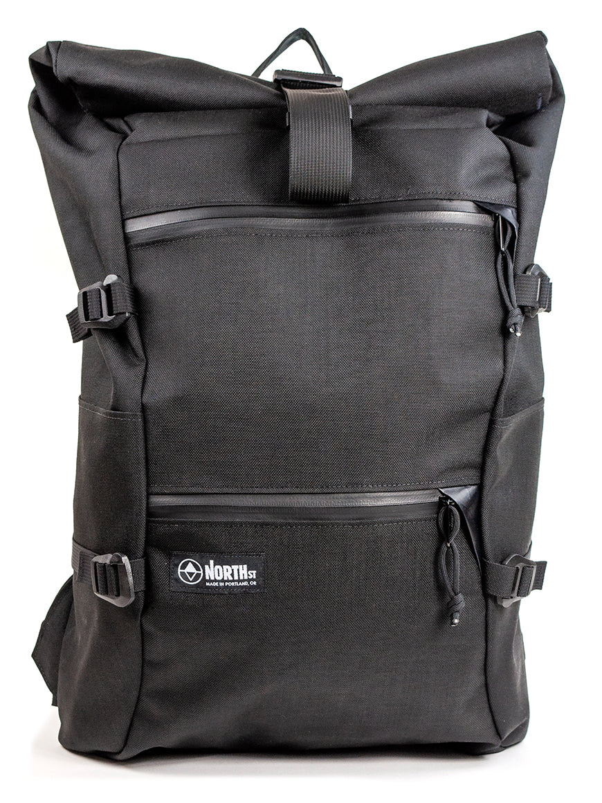 Black backpack with a visible brand logo on a white background