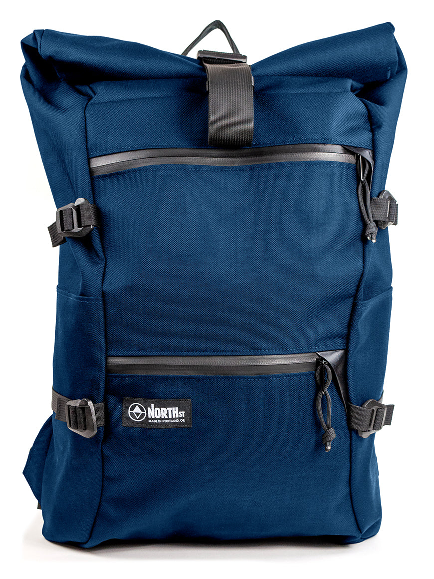 Blue backpack with black straps on a white background