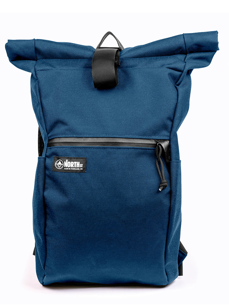 Midnight Blue roll-top backpack with a visible brand logo on a white background