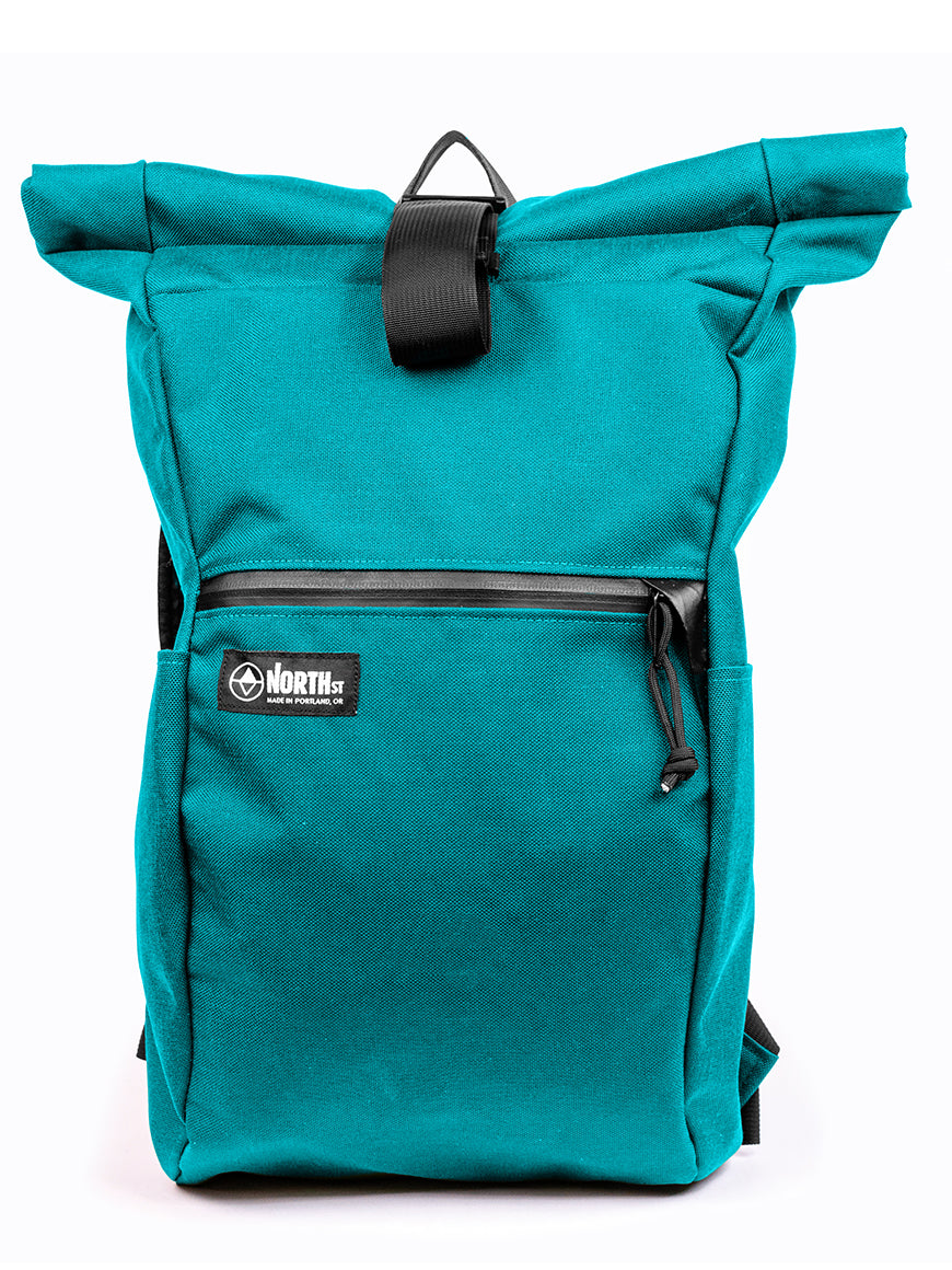 Teal roll-top backpack with a visible brand logo on a white background