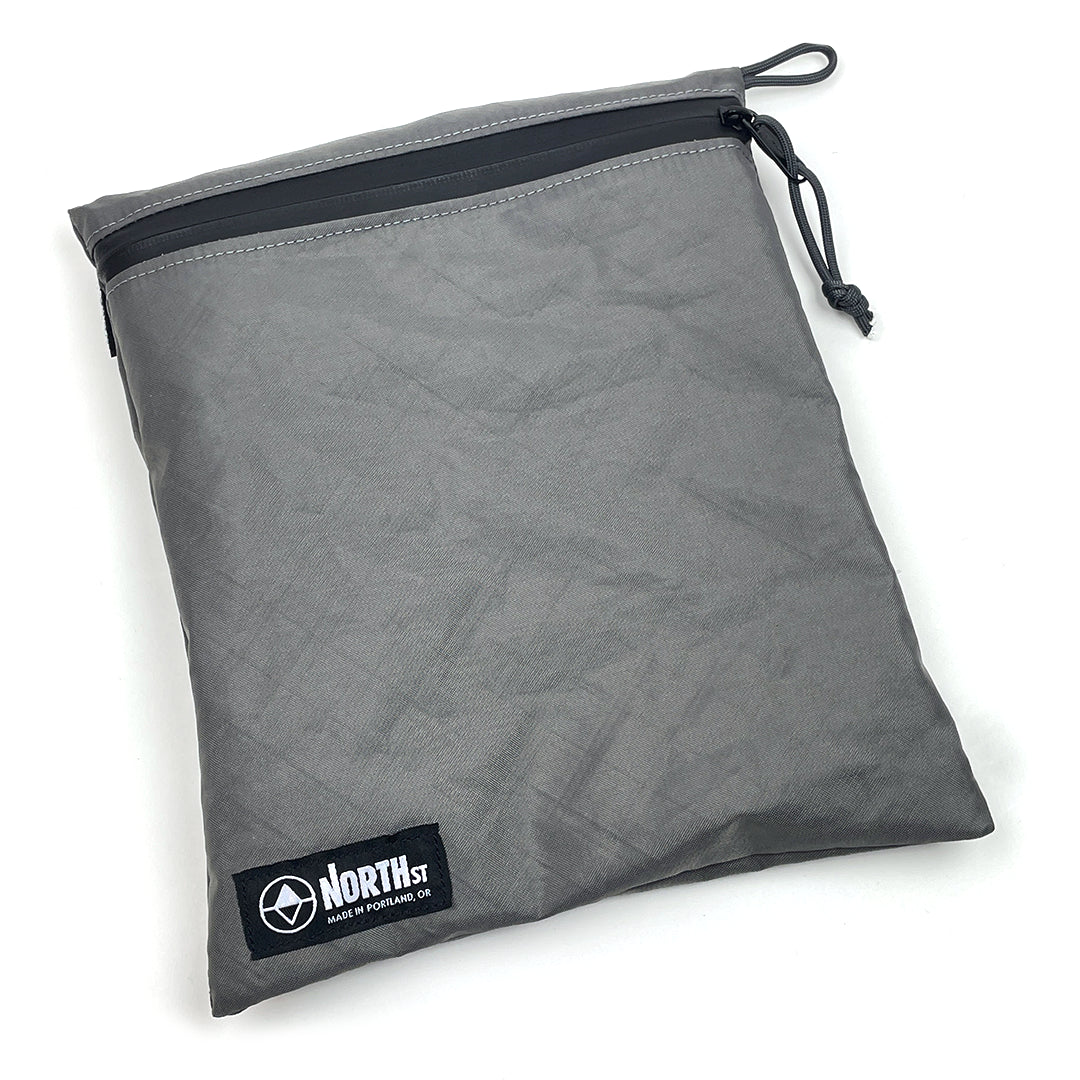 Large gray pouch with zipper and visible brand logo