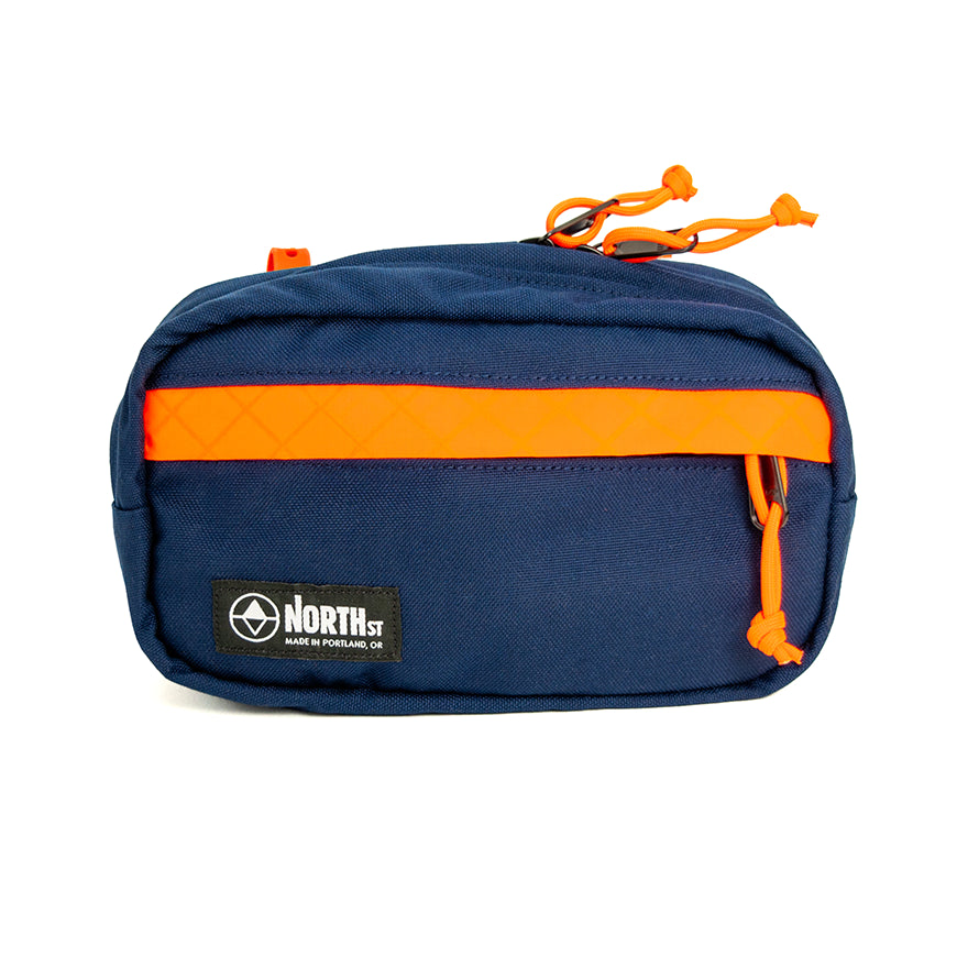Navy blue pouch with orange stripe and 'North St' logo on a white background