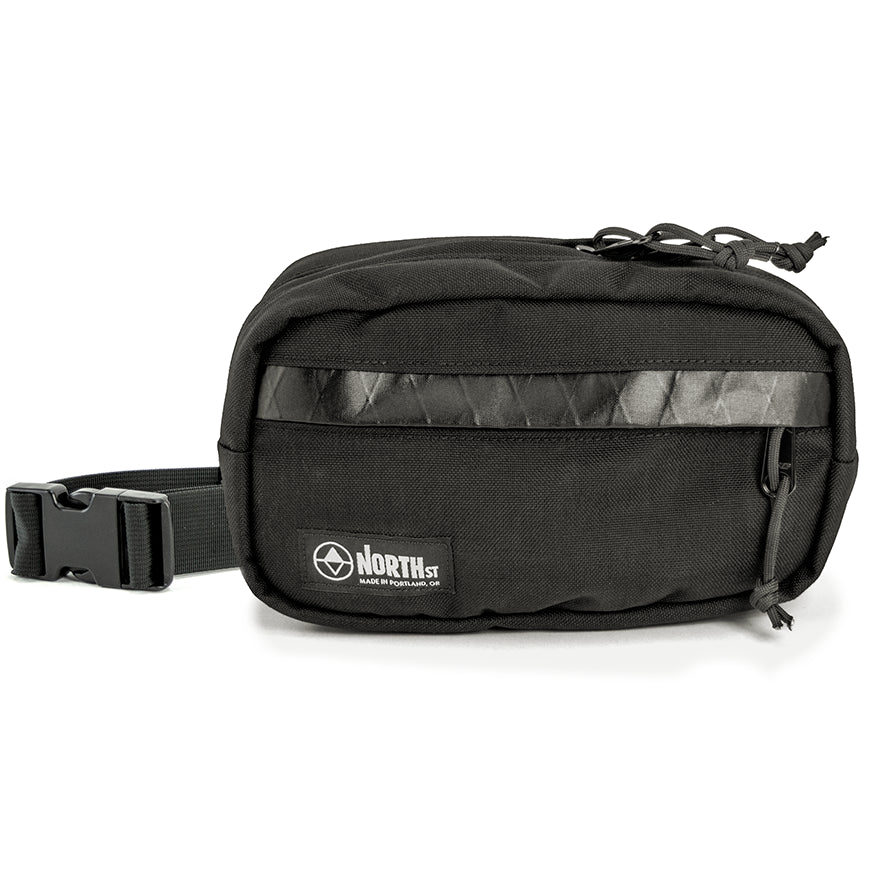 Black waist bag with a visible brand logo on a white background. Pioneer 9 by North St Bags