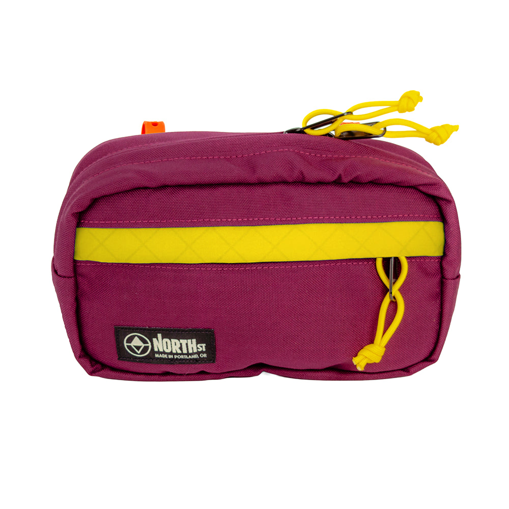 Front view of Pioneer 9 Handlebar Pack in Burgundy and Gold