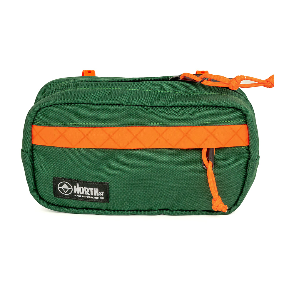 pioneer 9 handlebar pack on a white background in forest green and orange from North St Bags