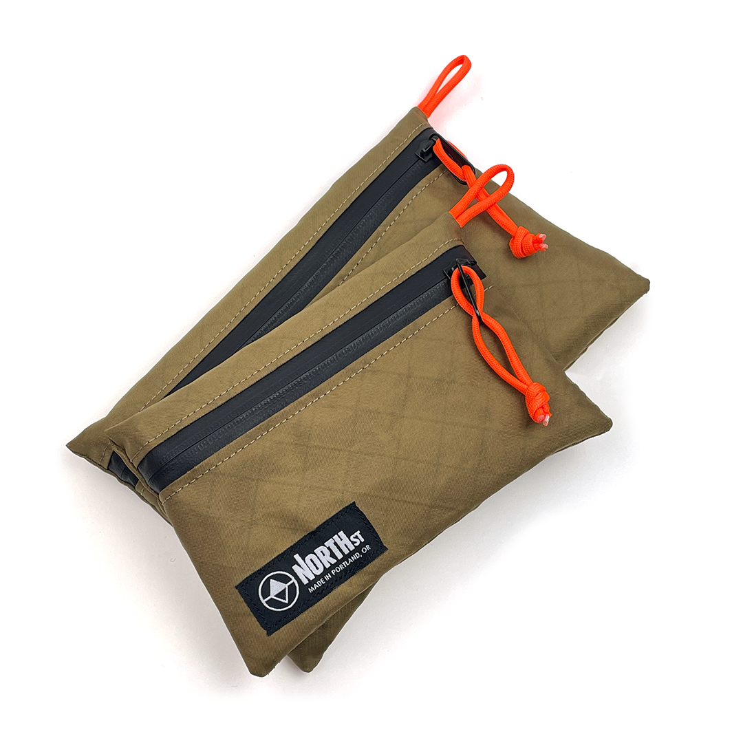 Coyote Tan pouch with orange drawstrings and a visible brand logo on a white background