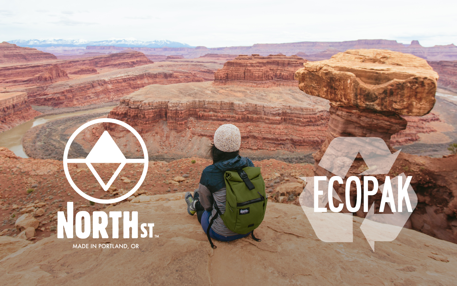 woman taking in a view at a canyon with backpack