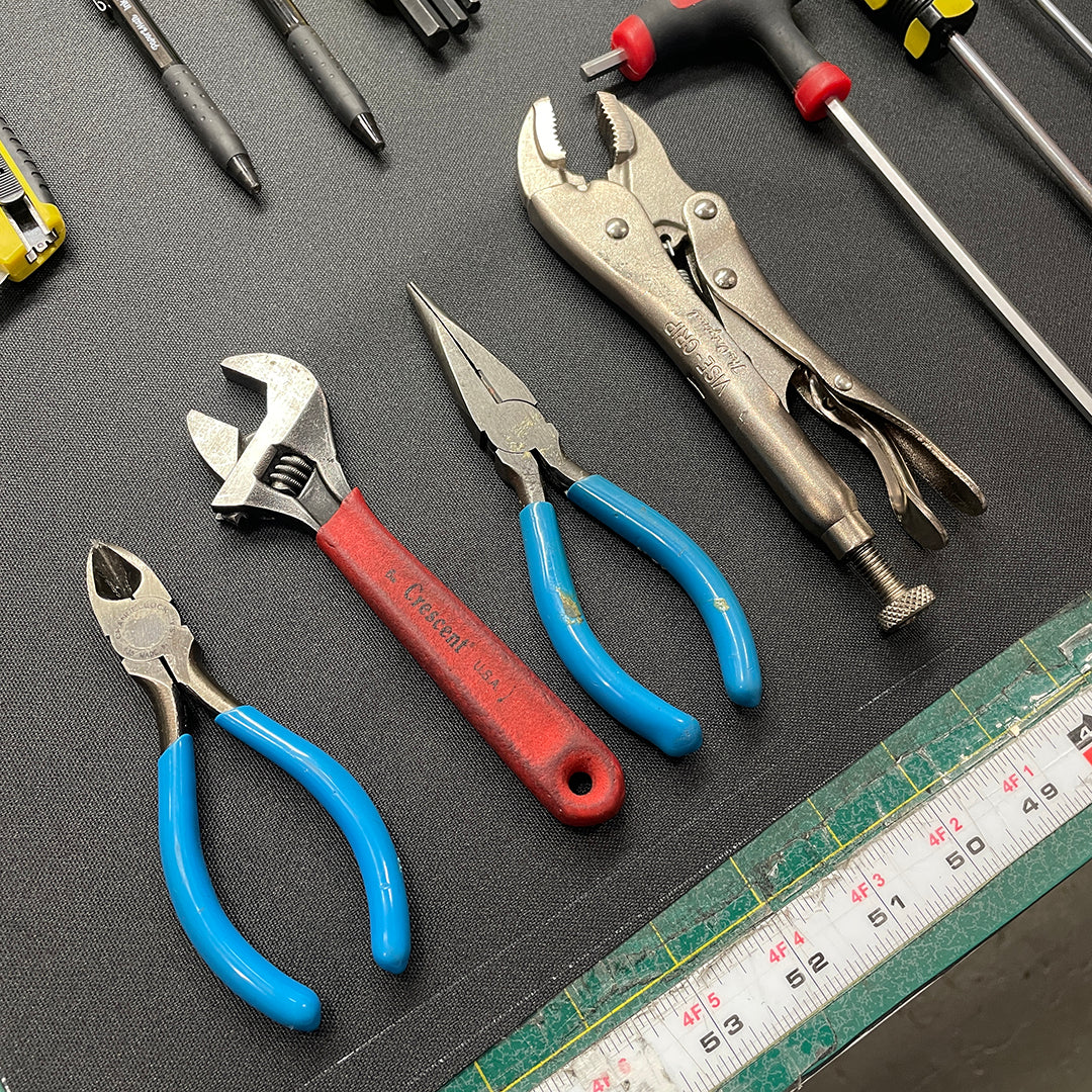 array of tools on a workbench