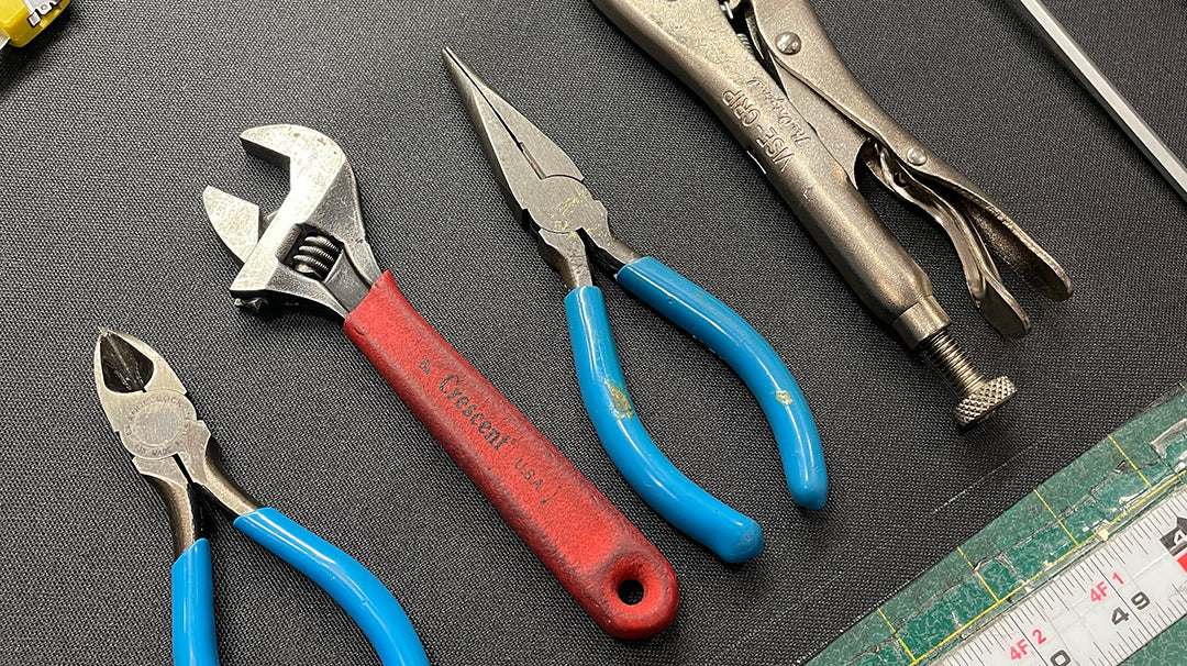 array of tools on a workbench