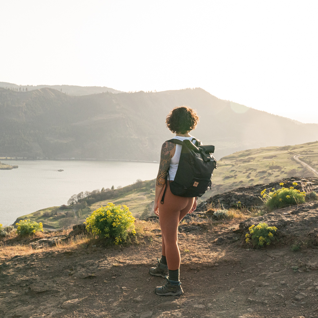 Woman wearing backpack on a hike in the Columbia River Gorge. | North St Bags