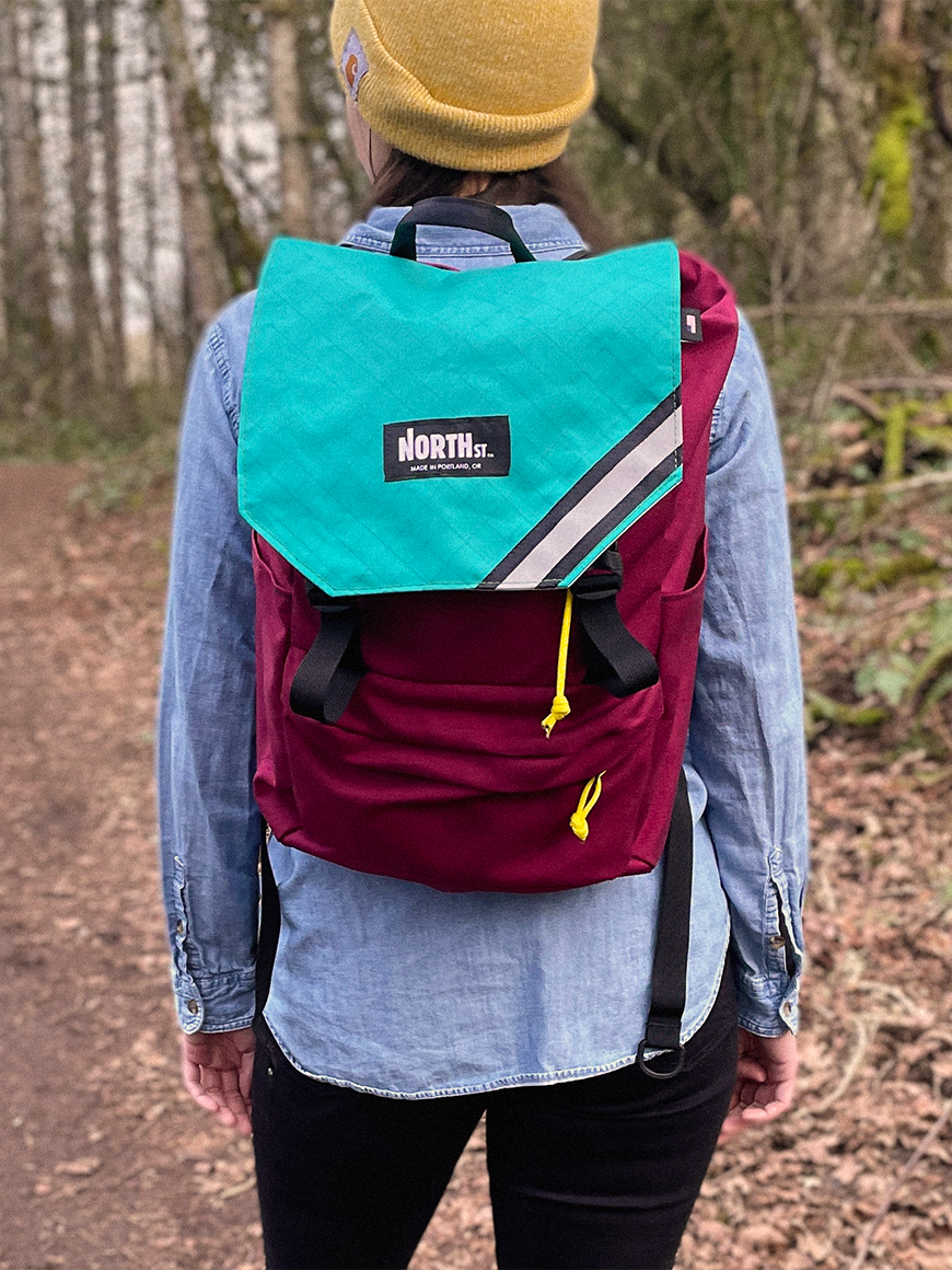 Woman wearing Belmont Backpack 22L on a hiking trail - North St. Bags