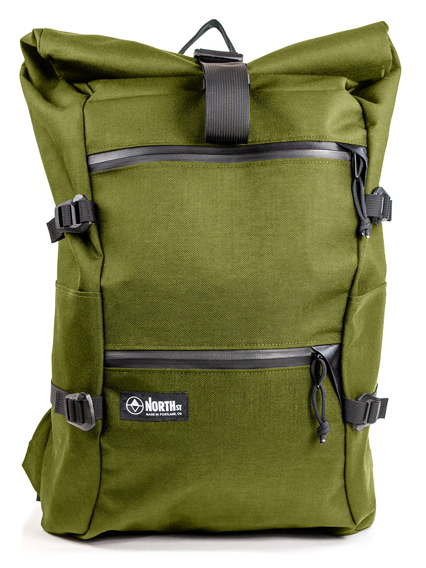 Green backpack with black straps on a white background