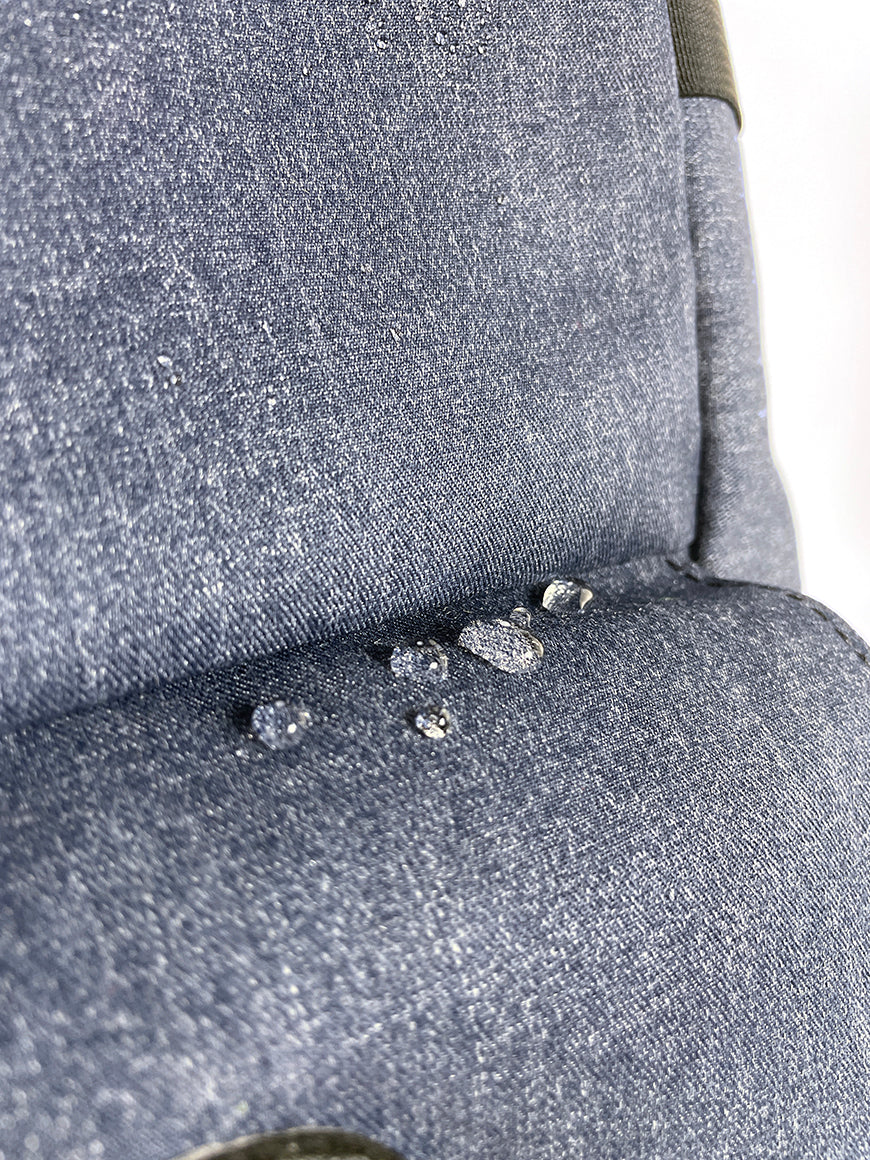 Closeup view of LDT denim fabric with water drops. - North St Bags all-groups
