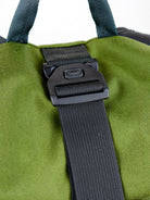 Green bag with a black strap and buckle on a white background all-groups