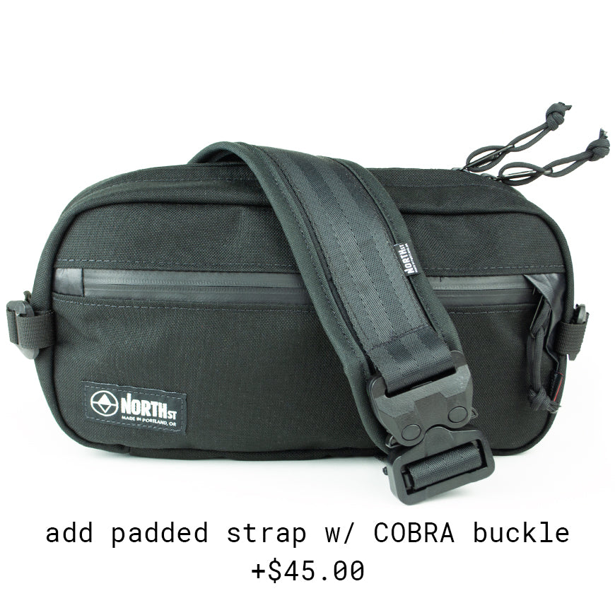 front view of Eliot Sling Pack with COBRA buckle strap in black