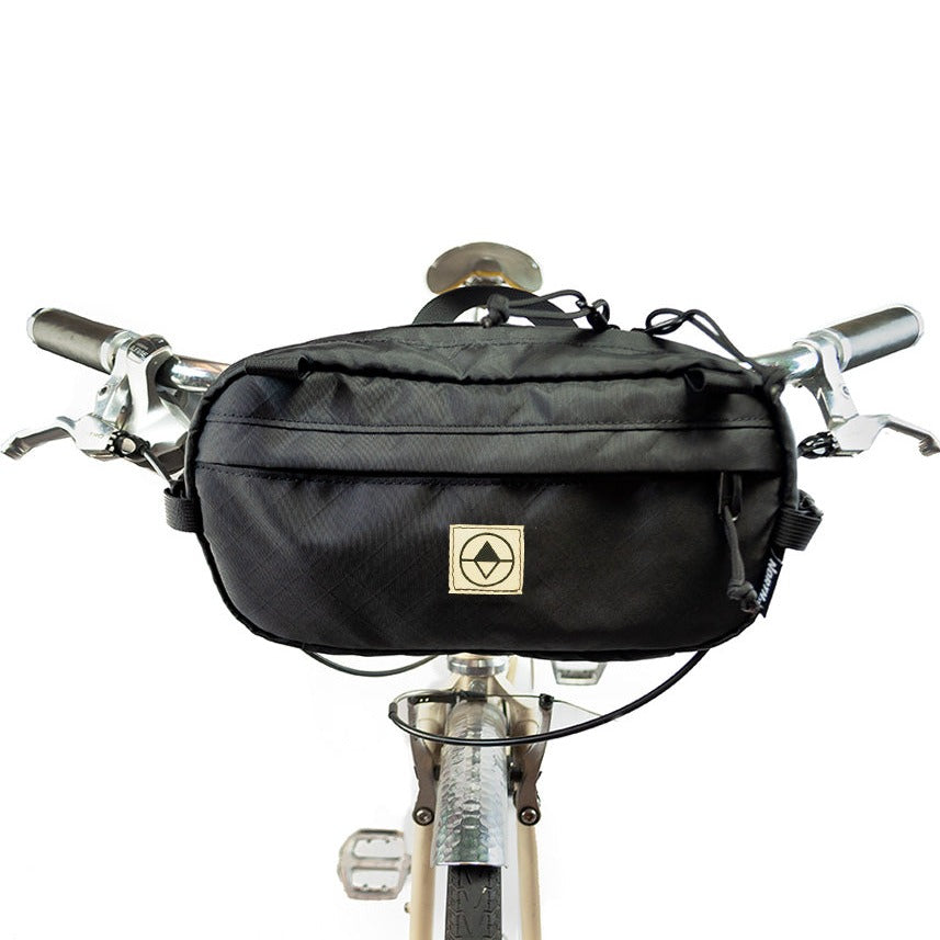 Pioneer 12 Pack in EPX Black mounted to a bike as a handlebar pack - North St. Bags all-groups