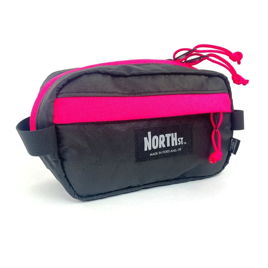 Front view of Pioneer 9 Handlebar Pack in black and pink - North St. Bags