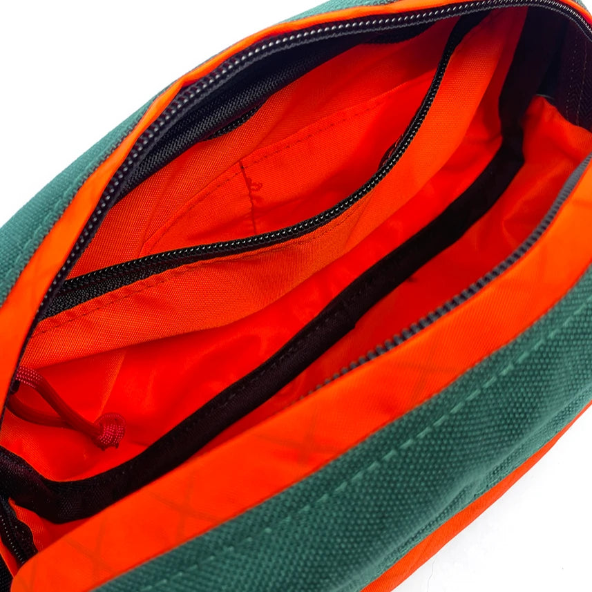 Interior view of Pioneer 9 Handlebar Pack in forest green and orange - North St. Bags