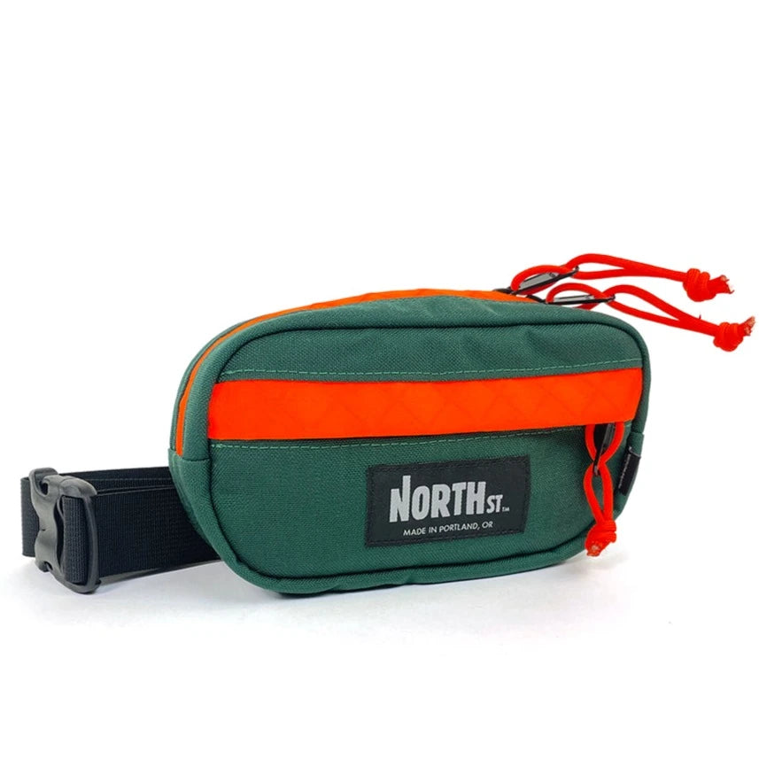 Front view of Pioneer 8 Hip Pack in Forest Green and Orange - North St. Bags