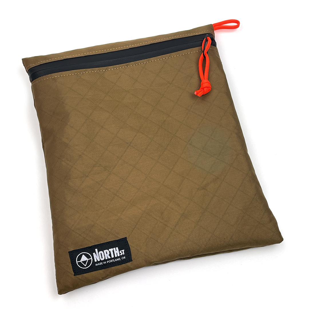 Large Tan pouch with zipper and visible brand logo