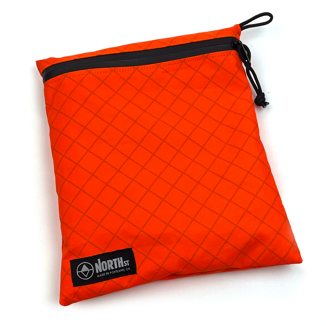 Large Blaze Orange pouch with zipper and visible brand logo