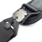 Close-up of a black belt with a metal buckle on a white background