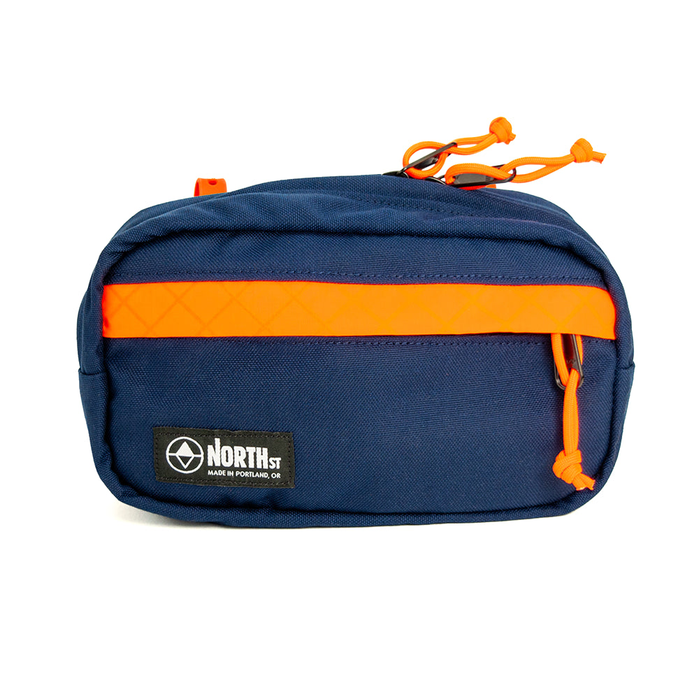 Front view of Pioneer 9 Handlebar Pack in Midnight and Orange