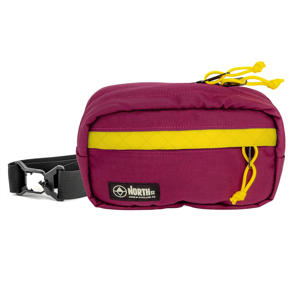 pioneer 9 hip pack in burgundy with gold accent and north st label