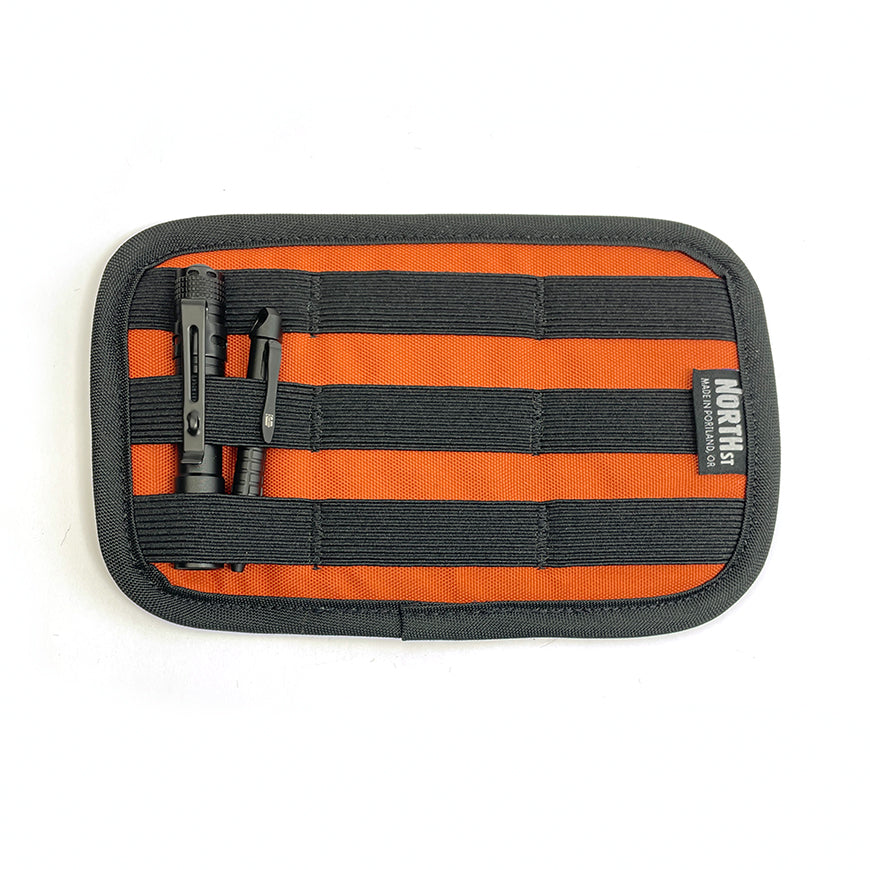Detail view of Shortstack EDC Organizer with items installed in elastic slots. - North St Bags all-groups