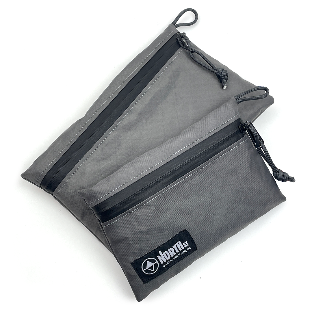 Gray pouch with Cords and visible brand logo on a white background
