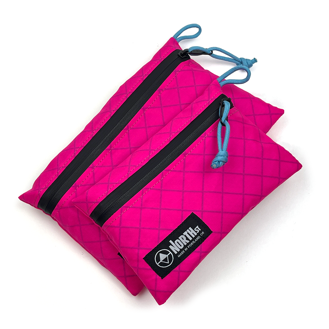 Hot Pink Pouches with Blue Cords on a white background