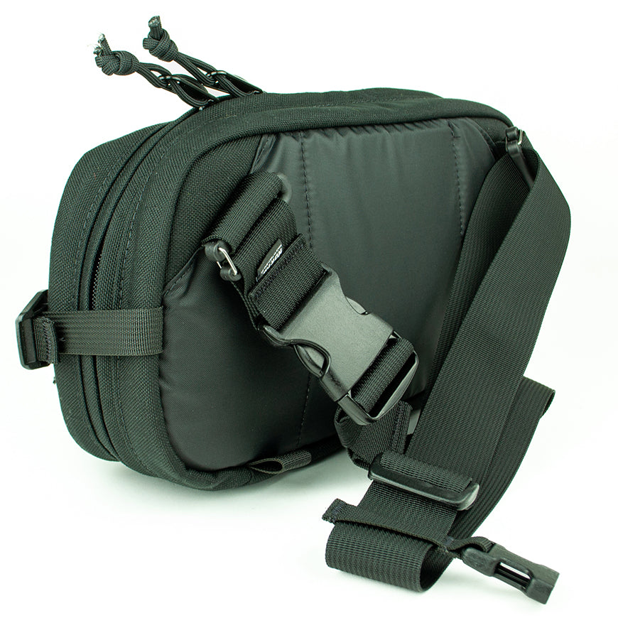 detail view of sling pack by North St showing back and strap