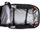 Open dark gray and silver backpack showing the interior with two black compression straps and bright orange zipper pulls on a white background.
