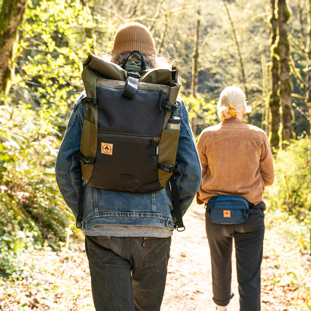Couple hiking on a forest trail. - North St. Bags all-groups